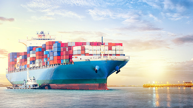 Large ship sailing in a sunset